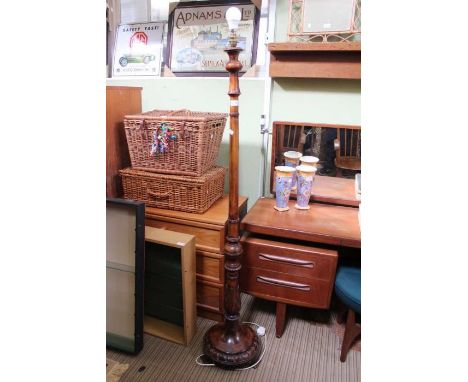 A wooden standard lamp