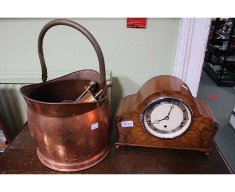 A walnut cased mantel clock, a copper coal scuttle with companion set