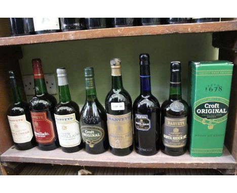 A shelf full of sherry various