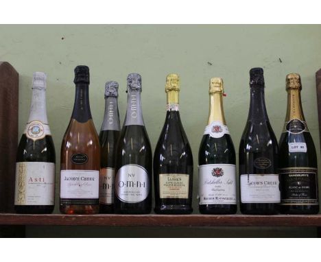 A shelf full of sparkling wines various