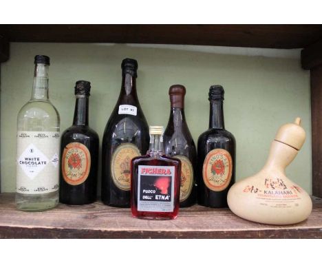 A shelf of beers and liqueurs to include Bass Royal Commemorative ale