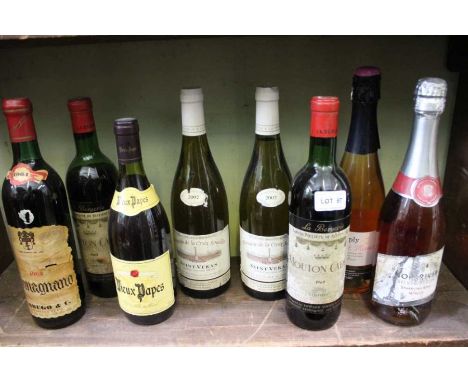 A shelf of red and white wines various