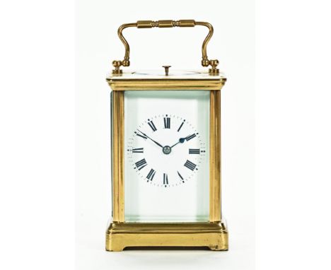 An early 20th century brass carriage clock with leather case, 13 cm high (see illustration).