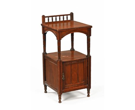 A late Victorian bedside cabinet with galleried upstand, open shelf and cupboard raised on short legs.  Height excluding upst