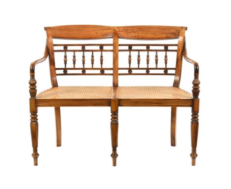 A late 20th century period style satinwood salon seat, with rail and turned double back with sweep arms, double bergere cane 