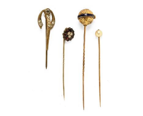 A collection of four antique stick pins.