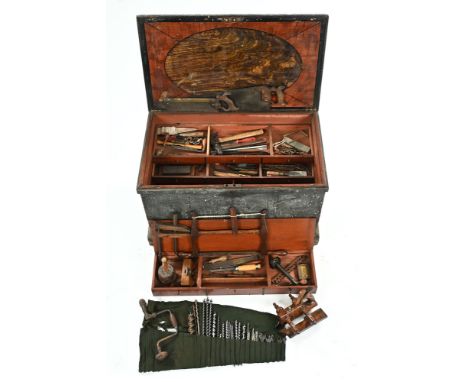 A 19th century large toolbox with fitted interior, sliding drawer compartments and selection of tools, brass bound saw, plane