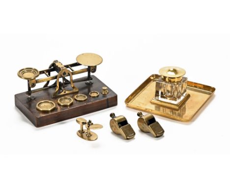 Edwardian compact weighing scales, together with a square glass and brass inkwell, two whistles and a miniature weighing scal