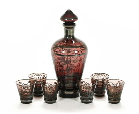 A continental glass spirit flask, with six shot glasses to accompany.