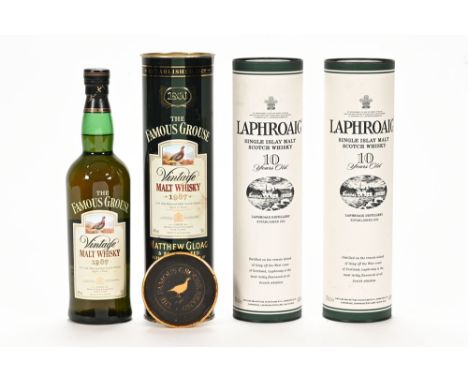 A collection of three bottles of whisky, to include two Laphroaig Islay single malt Scotch whisky, 10 year old and a bottle o