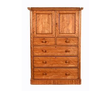 A mid Victorian satinwood cupboard/demi linen press, with cornice over double cupboard with two short and three long cockbead