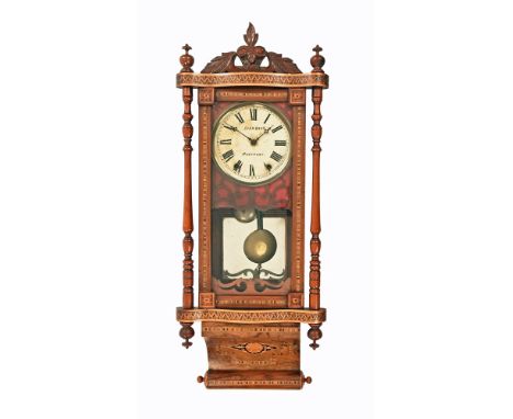 Over Bros Maryport an Edwardian inlaid wall clock, with pendulum and key.  Overall height 97 cm, width +/- 40 cm, protruding 