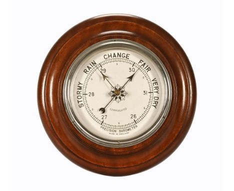 A 20th century circular wall barometer "Precision Barometer Made in England".  Diameter to include wooden mount 27 cm.