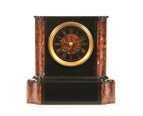 An early 20th century polished marble and black slate mantel clock, 22 cm high.   CONDITION REPORT:  The clock case is in goo
