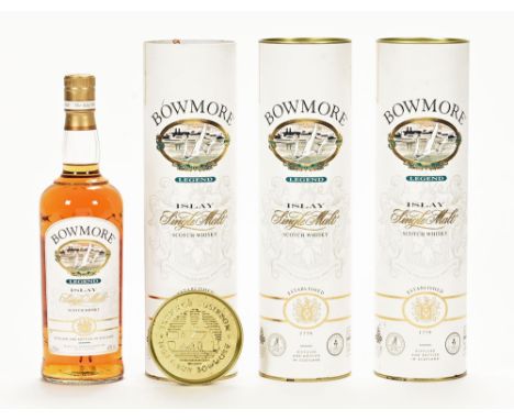 A collection of three bottles of Bowmore Legend Islay single malt Scotch whisky. *