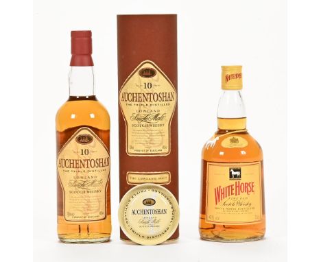 A bottle of Auchentoshan 10 year old triple distilled Lowland single malt Scotch whisky, 700 ml, 40% vol. together with a bot