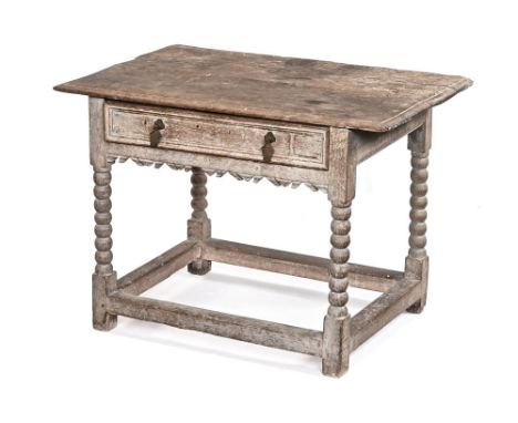 A 19th century bleached oak side table, in the 18th century style having rectangular top with frieze drawer on bobbin legs an