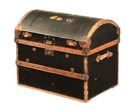 An early 20th century brass bound domed trunk.  65 cm high.