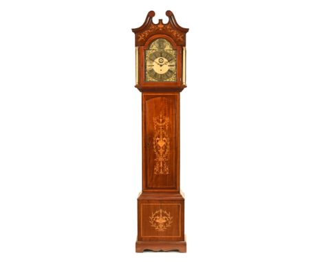 An Edwardian inlaid mahogany musical longcase clock, with three train movement striking on eight bells and five gongs, inlaid