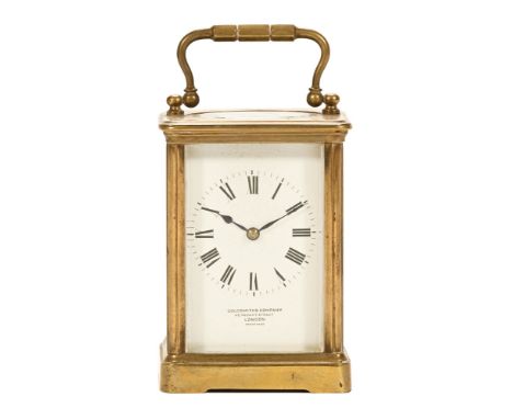 An early 20th century brass and glass panelled carriage clock, by Goldsmiths Company 112 Regent Street London, Paris made, wi