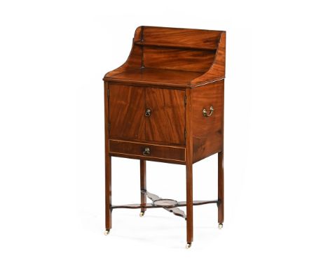 A Georgian mahogany pot cupboard, with rear upstand and shelf above a pair of cupboard doors, inlaid drawer and square legs s