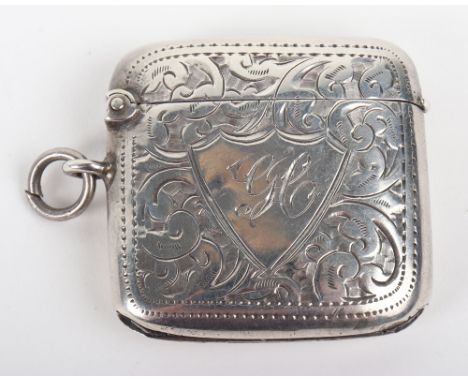 A silver vesta, Birmingham 1909, decorated with foliate-scroll, 4cmWx4cH, 23g