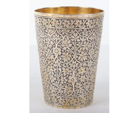 A good Persian silver gilt beaker, decorated with scrolling foliage, 10cmhx7cmDiam 137g