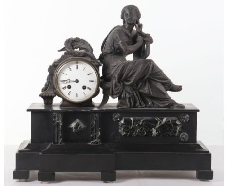A late 19th century French slate and marble mantle clock, lady seated with a lyre, white enamel dial with Roman numerals, 47c