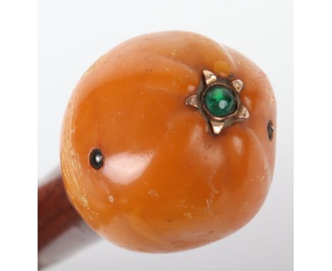 A 19th century Russian butterscotch amber, diamond, gold and enamel cane handle, 3cmDiam