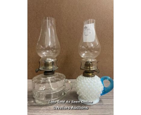 *AMERICAN MAKE SMALL OIL LAMP WITH OPAQUE GLASS RESERVOIR AND BLUE HANDLE; A GLASS OIL LAMP