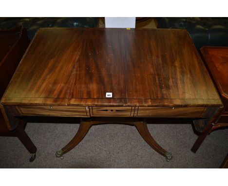 A George IV mahogany sofa table, decorated with ebony stringing, fitted two frieze drawers, 69cms high.