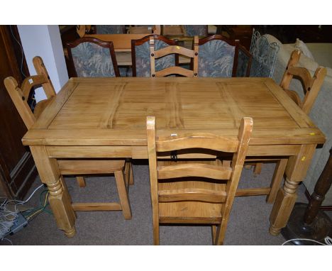 A modern stained wood kitchen table fitted a single drawer; together with four solid seat ladder back chairs, the table 140 x