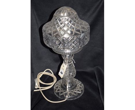 A 20th Century cut-glass table lamp, bulbous shade on shaped column, raised on circular base.