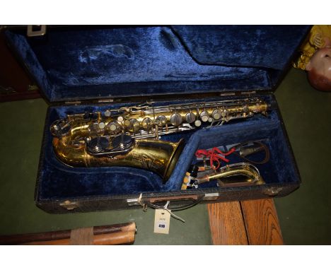 A brass and steel Champion B&M saxophone, in fitted case.