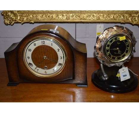 A Russian Majak mantle clock, the arabic dial within clear bezel on metal supports; together with an oak cased mantle clock. 