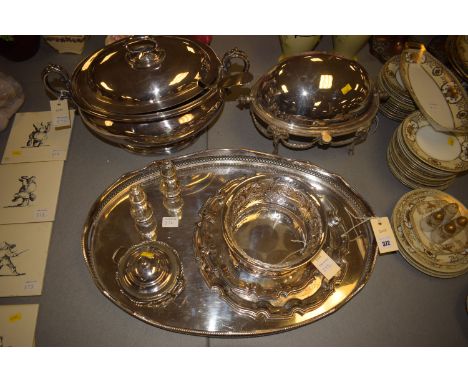 A large oval E.P.N.S. tray with shaped pierced gallery; a large oval tureen with cover and ladle; an oval breakfast serving d
