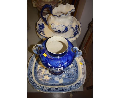 A large blue and white Victorian-style wash jug and matching oval bowl (damaged); together with 19th Century blue and white c