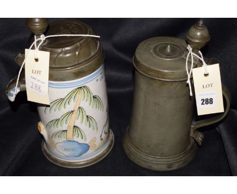 An antique pewter tankard with hinged cover, inscribed with initials and marks and the date 1791; together with ceramic Majol