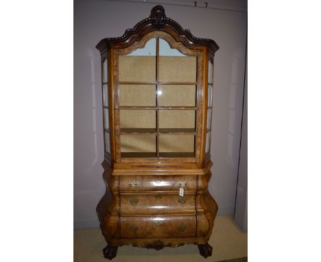 A good quality Dutch burr walnut display cabinet, bearing label "Meubelbewaring K. Wittock, 24.4.47", the serpentine leaf car