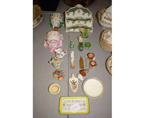 Two Victorian ceramic basket-form wall pockets, with raised hand-painted ivy leaf decoration, one in green and one in pink; t