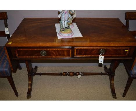 A Chapmans Siesta range reproduction mahogany sofa table, with ebonised stringing and crossbanding, fitted two short frieze d