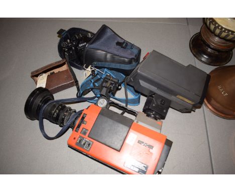 A JVC professional video camera, fitted VF-2500E viewfinder; an Agfa Karat camera; and a Zenith II camera.