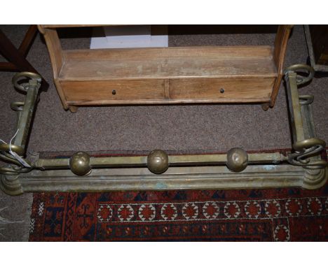 A brass fire surround.