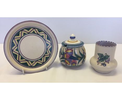 3 items of Poole pottery. Comprising a plate, bud vase and a lidded jam pot. 