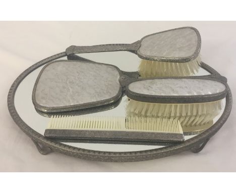 Vintage white metal / silver plate dressing table set. Comprising: Hand mirror, comb, hair brush and clothes brush.  The bris