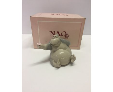 A boxed Nao porcelain figurine of a gorilla holding a pink flower. "As Beautiful as you", model #1324. Slight damage to pink 