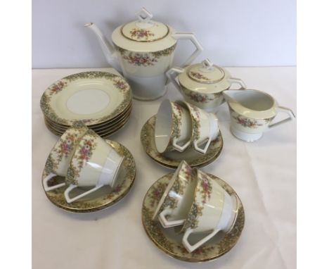 An Art Deco shaped yellow and floral 6 setting Noritake tea set. Comprising; tea pot, milk jug, sugar bowl, 6 tea plates and 