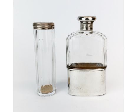 Two hallmarked silver topped dressing table bottles.