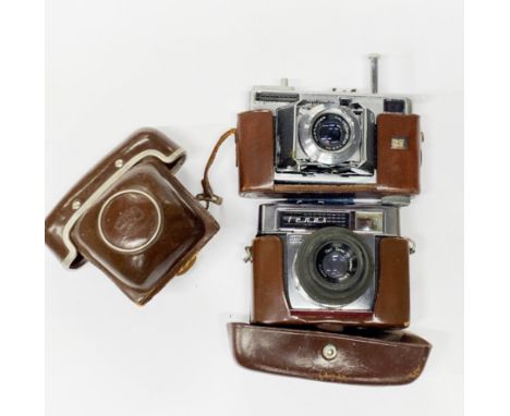 A Voightlander synchro-compur camera. Together with a further vintage camera.
