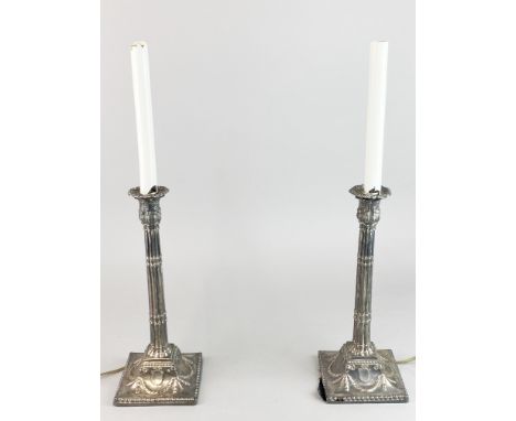 A pair of silver plated column candlestick table lamps, H. 51cm.